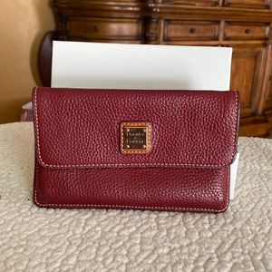 Dooney and Bourke wristlet Burgundy color